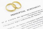 Form of prenuptial agreement with a pair of wedding rings - prenuptial agreements concept