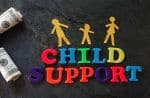 Paper family with Child Support letters and money - child support for special needs child concept